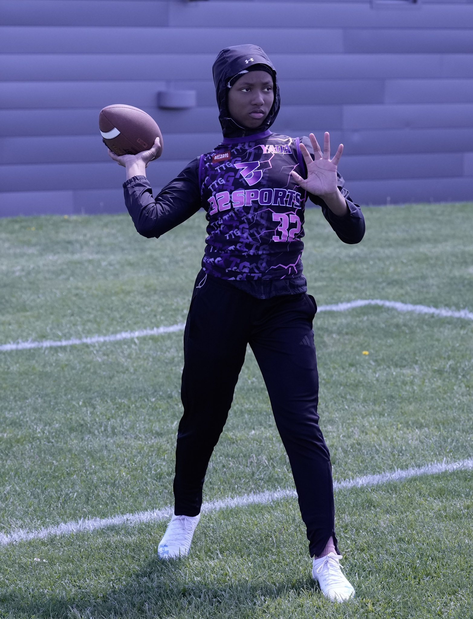 32 Sports quarterback preparing to throw a football